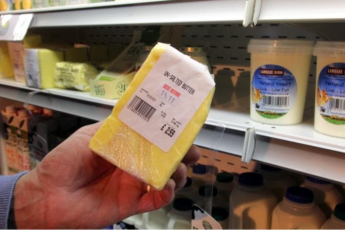 A block of unsalted butter cut to size at the Churston dairy shelves