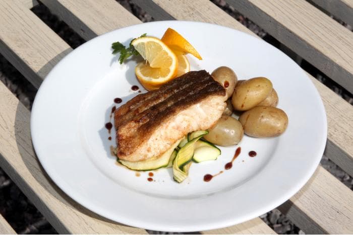 Grilled fish with new potatoes and courgette — a lunchtime special at Caroline's Kitchen
