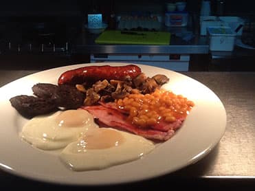 The Churston Breakfast — bacon, sausage, eggs and all the trimmings, cooked from the farm shop's own produce