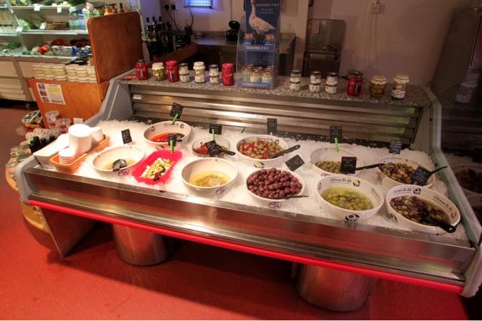 The olive and antipasti bar on crushed ice at the Churston deli