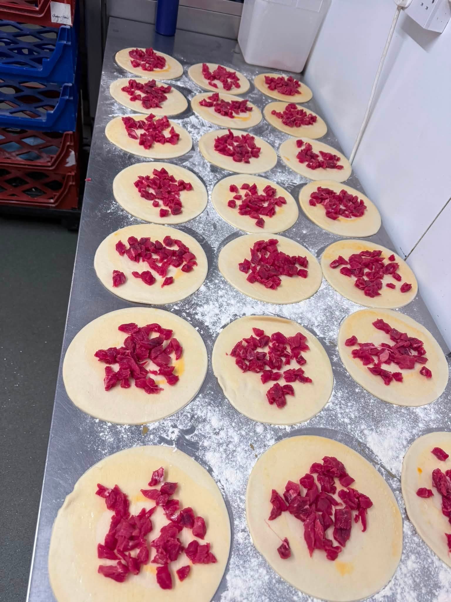 Hand-diced beef laid onto pastry rounds for handmade pasties